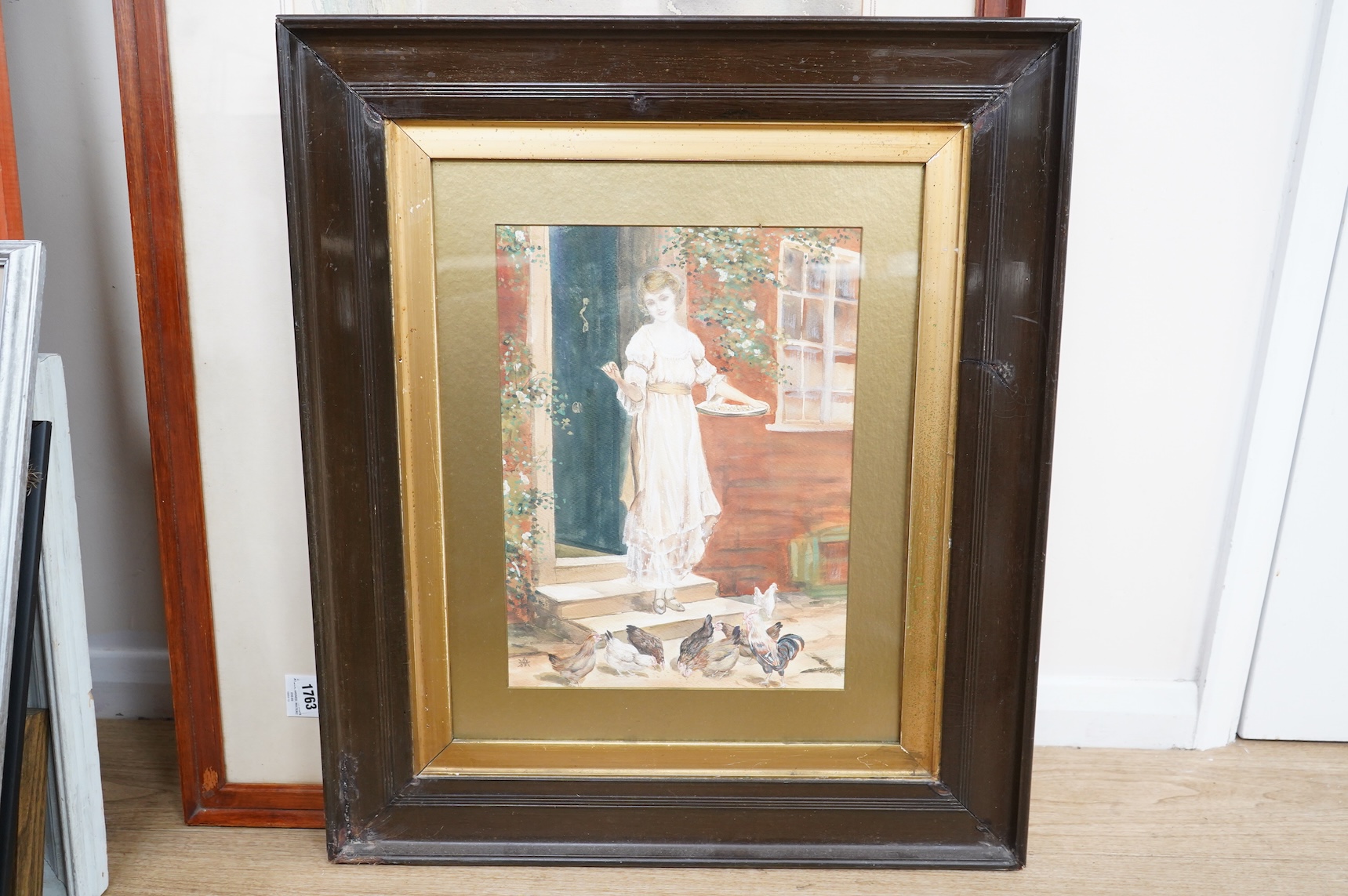 Victorian School, Lady feeding chickens, monogrammed AW? watercolour heightened with white, 39 x 29cm